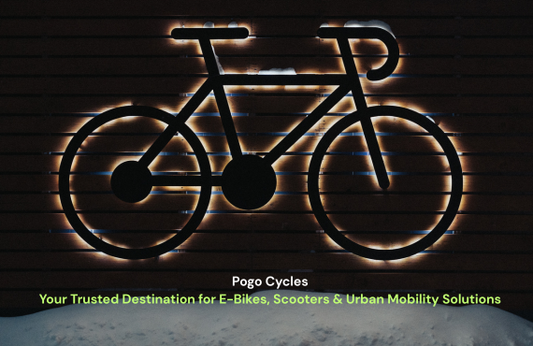 Illuminated bicycle outline on wooden wall with Pogo Cycles e-bikes and scooters tagline